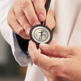 Chestpiece of a 3M Littmann Stethoscope with the Littmann seal on the diaphragm.